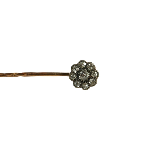 12B - A VICTORIAN YELLOW METAL AND DIAMOND CLUSTER STICK PIN, YELLOW METAL TESTED AS 14CT GOLD
Central rou... 