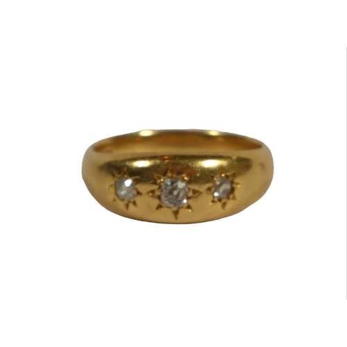 4B - A LARGE 18CT GOLD, THREE STONE DIAMOND GYPSY SET RING
The central diamond having old European slight... 