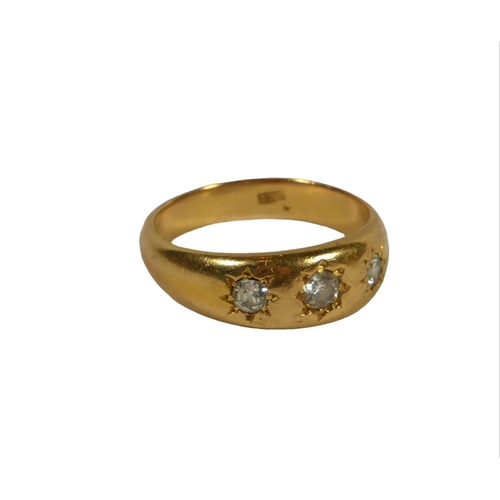 6B - A LARGE 18CT GOLD, THREE STONE DIAMOND GYPSY SET RING
The central diamond having old European round ... 