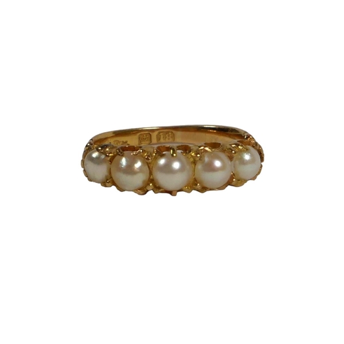 8B - A VICTORIAN 18CT GOLD AND FIVE PEARL RING
having chased and engraved ornate shoulders.
(UK ring size... 