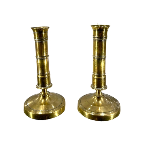 66A - A PAIR OF GEORGIAN BRASS CANDLESTICKS, Height-17cm, Diameter-8.7cm.