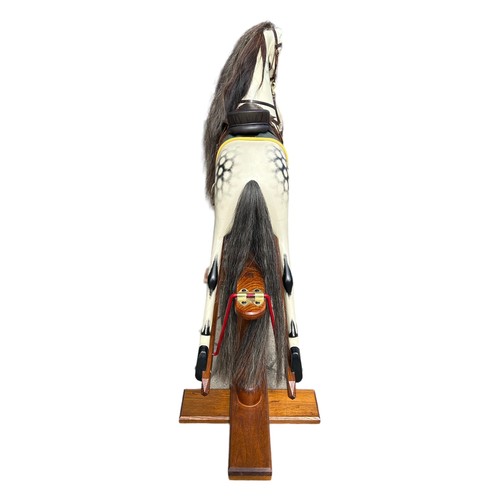 68 - ROCKING HORSE SHOP, A LARGE DECORATIVE CARVED WOOD DAPPLED ROCKING HORSE, with glass eyes leather sa... 