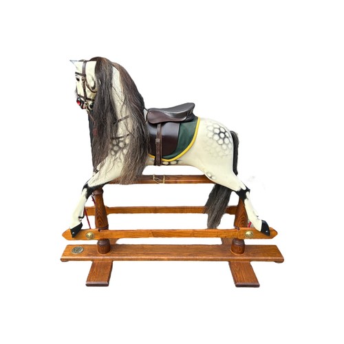 68 - ROCKING HORSE SHOP, A LARGE DECORATIVE CARVED WOOD DAPPLED ROCKING HORSE, with glass eyes leather sa... 