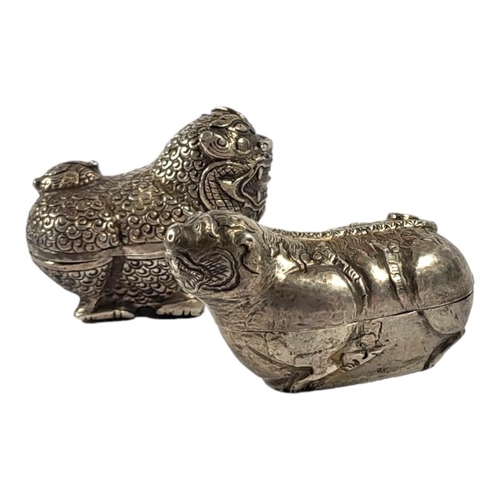 109 - TWO LATE 19TH/EARLY 20TH CENTURY CAMBODIAN SILVER LION DOG BETEL BOXES
Having chased textured decora... 