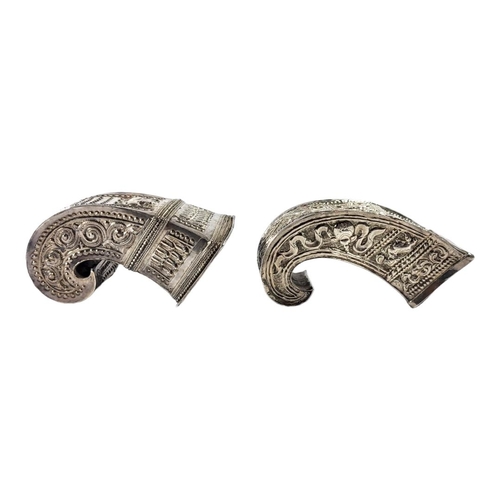 111 - TWO LATE 19TH/EARLY 20TH CENTURY BURMESE SILVER BETEL LEAF HOLDERS
Both having intricate chased and ... 