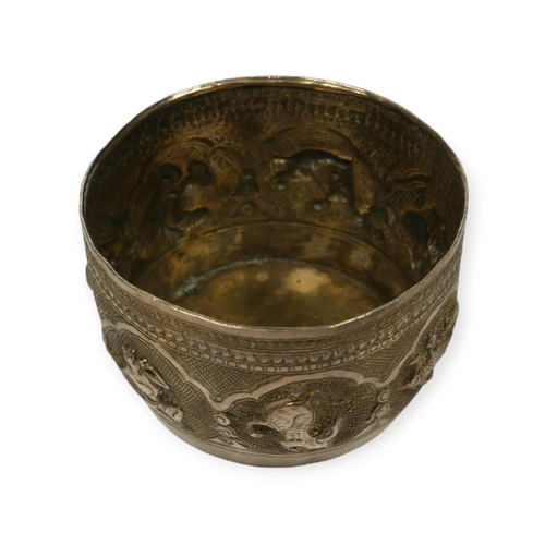 112 - A LATE 19TH/EARLY 20TH CENTURY BURMESE SILVER BOWL
Decorated with seven repoussé cartouches depictin... 