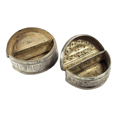 115 - TWO LATE 19TH/EARLY 20TH CENTURY BURMESE SILVER LIME BOX
Demilune form, both having chased stylised ... 
