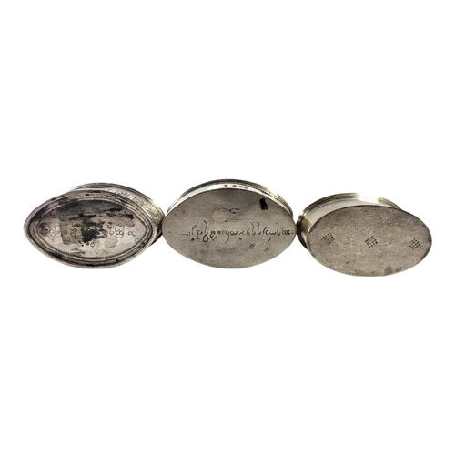116 - THREE LATE 19TH/EARLY 20TH CENTURY OVAL BURMESE SILVER BETEL LIME BOXES
Having two having chased Chi... 