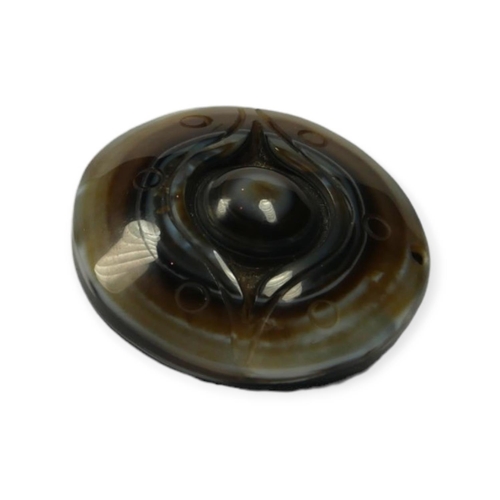 134 - TIBETAN CARVED AGATE BUDDHIST HEAVEN EYE PENDANT.

Provenance: private collection of a gentleman