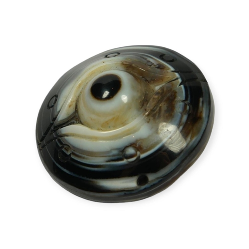 134 - TIBETAN CARVED AGATE BUDDHIST HEAVEN EYE PENDANT.

Provenance: private collection of a gentleman