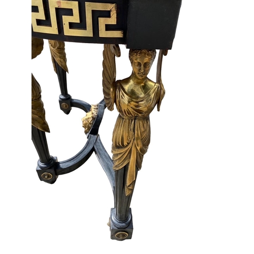 221 - A 19TH CENTURY NEOCLASSICAL DESIGN EBONISED AND GILT METAL MOUNTED CONSOLE TABLE
The white marble to... 