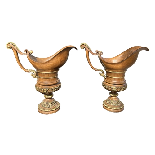 162 - A LARGE PAIR OF NEO-CLASSICAL DESIGN CARVED WOOD & PARCEL GILT EWERS.
(h 64cm)