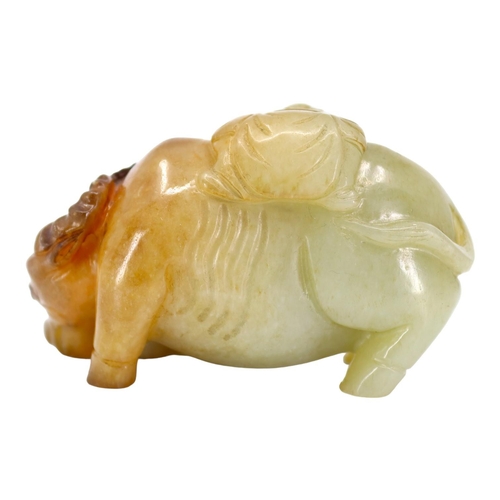 120 - A CHINESE PALE GREEN AND RUSSET JADE ‘BOYS & BUFFALO’ CARVING
Recumbent water buffalo carved with tw... 