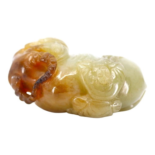 120 - A CHINESE PALE GREEN AND RUSSET JADE ‘BOYS & BUFFALO’ CARVING
Recumbent water buffalo carved with tw... 
