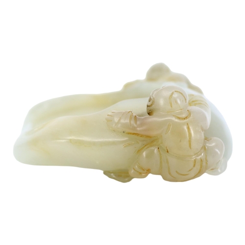 122 - A CHINESE GREENISH-WHITE JADE ‘PEACH & BOYS’ BRUSH WASHER CARVING
Two boys climbing to mouth rim, on... 
