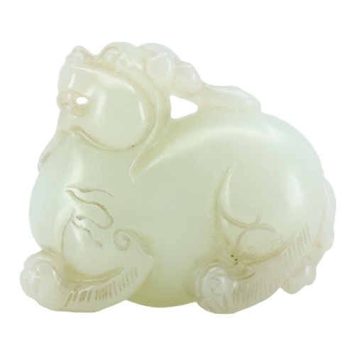 124 - A CHINESE WHITE JADE CARVING OF A QILIN
The mythical beast is nicely carved and pierced underneath h... 