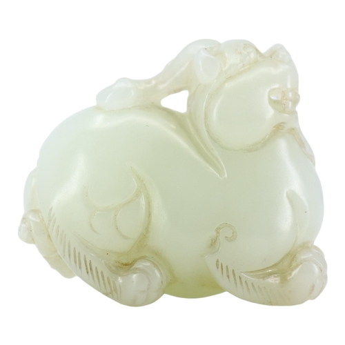 124 - A CHINESE WHITE JADE CARVING OF A QILIN
The mythical beast is nicely carved and pierced underneath h... 