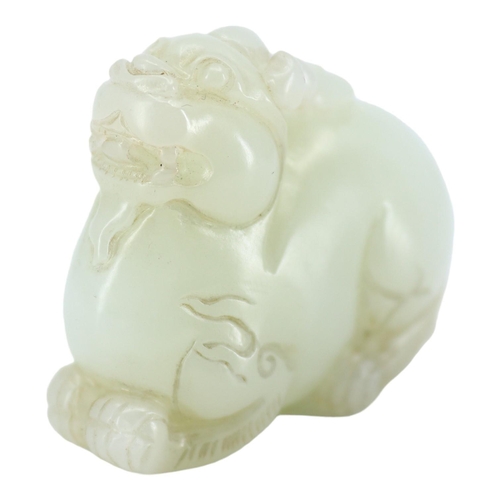 124 - A CHINESE WHITE JADE CARVING OF A QILIN
The mythical beast is nicely carved and pierced underneath h... 