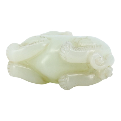 124 - A CHINESE WHITE JADE CARVING OF A QILIN
The mythical beast is nicely carved and pierced underneath h... 
