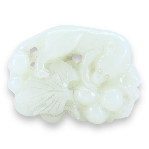 125 - A CHINESE WHITE JADE 'SQUIRREL AND GRAPE' GROUP CARVING
The pebble carved, pierced and partially hol... 