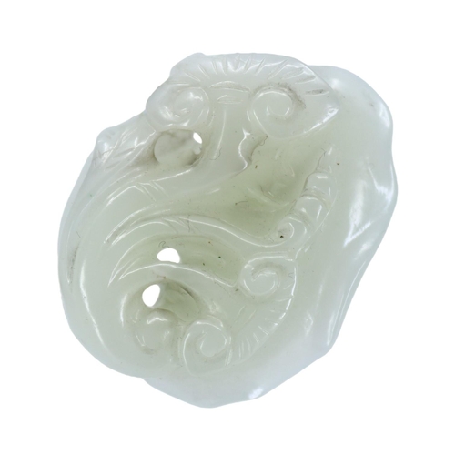 128 - A CHINESE WHITE JADE CARVED LINGZHI FUNGUS PENDANT
The pebble carved and pierced depicting three lin... 