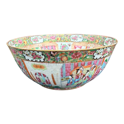 139 - A LARGE EARLY 19TH CENTURY CHINESE CANTON FAMILLE ROSE BOWL
Circular form having multiples panels sh... 