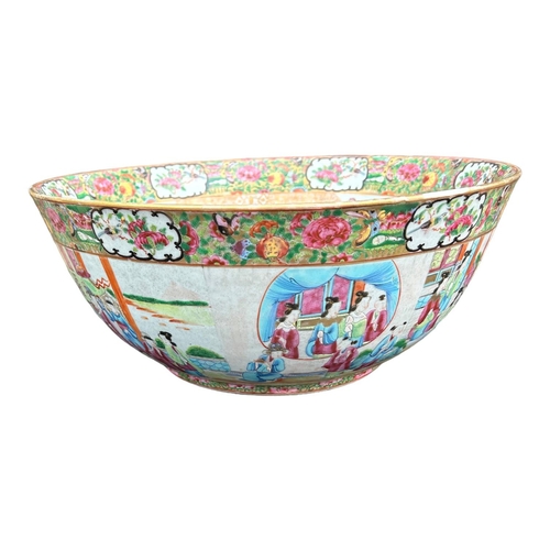 139 - A LARGE EARLY 19TH CENTURY CHINESE CANTON FAMILLE ROSE BOWL
Circular form having multiples panels sh... 