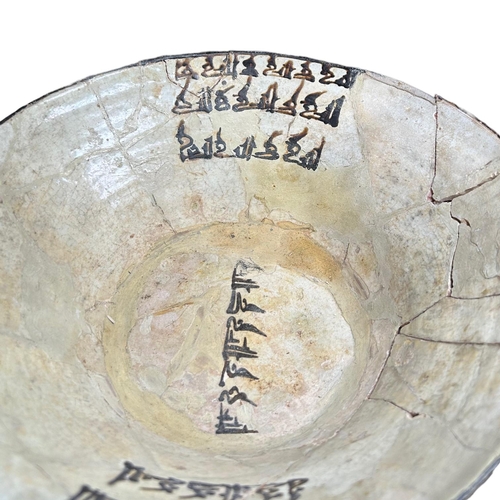 152 - IRAN 9TH-10TH CENTURY, A LARGE NISHAPUR POTTERY BOWL 
Having three sets of floriated Kufic inscripti... 