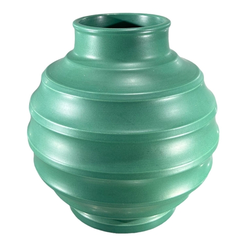 159 - KEITH MURRAY, WEDGWOOD. A QUEENSWARE GREEN VASE, SHAPE 4196
Ribbed form, makers marks to underside. ... 