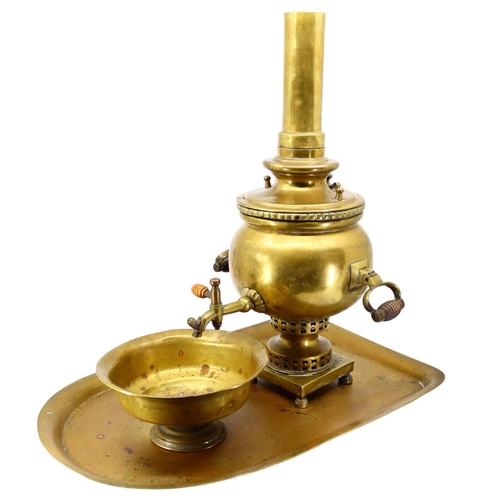 166 - BATASHEV, A 19TH CENTURY RUSSIAN BRASS SAMOVAR, TRAY AND DRIP BOWL
Having two wooden handles raised ... 