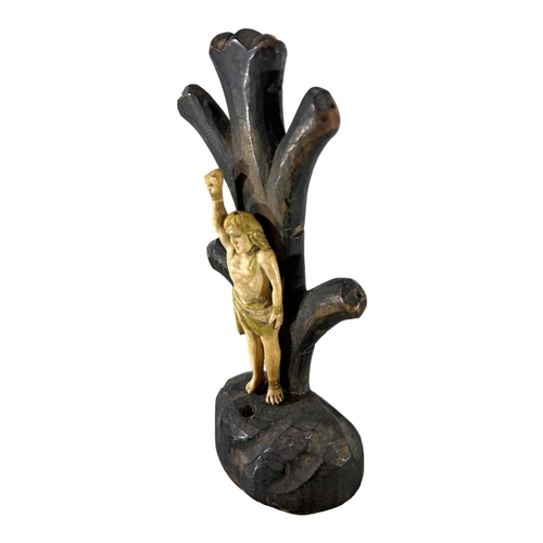 171 - AN 18TH /19TH CENTURY CONTINENTAL BONE AND WOOD CARVING OF ST SEBASTIAN TIED AGAINST A TREE. 
(h 15.... 