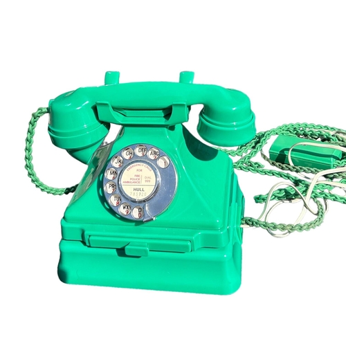 205 - A 1950’S TYPE 232 SERIES GREEN BAKELITE TELEPHONE AND TERMINAL BOX, Impressed marked 164, 56, exchan... 