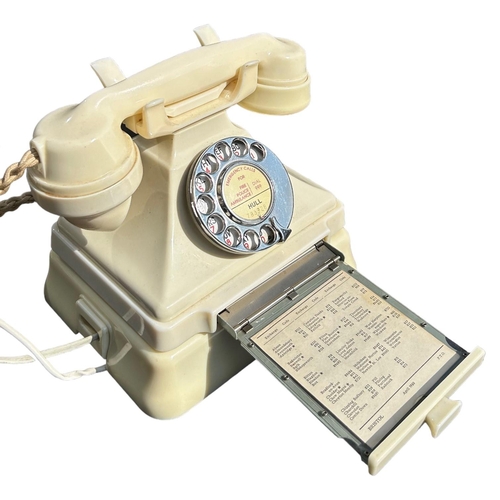 206 - A 1950’S TYPE 232 SERIES IVORY BAKELITE TELEPHONE AND TERMINAL BOX
Impressed marked 164, 50, exchang... 