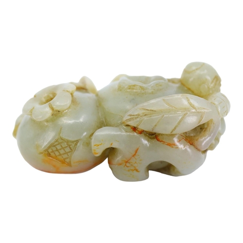 121 - A CHINESE PALE GREEN AND RED VEINED JADE ‘POMEGRANATES & BOY’ CARVING
Two pomegranates with boy clin... 