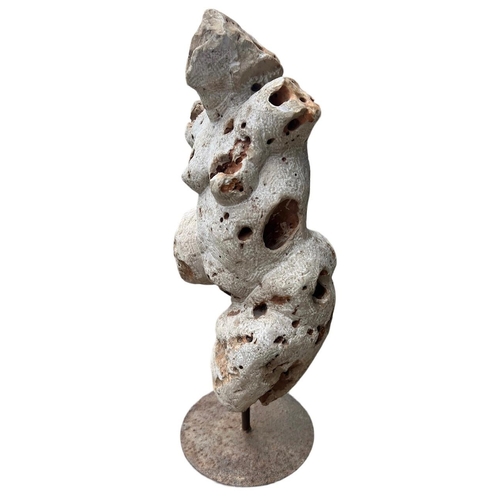 156 - POSSIBLY GREEK, A HEAVY PERFORATED CARVED STONE NUDE FEMALE FIGURE, POSSIBLY OF APHRODITE, MOUNTED O... 
