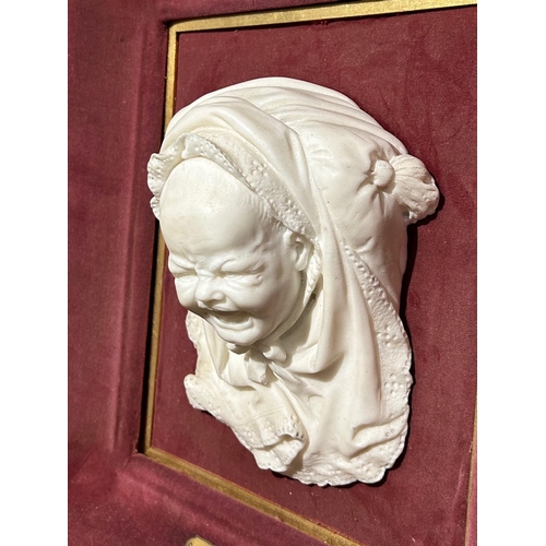 213 - A 19TH CENTURY CARVED PORTRAIT BUST OF A BABY CRYING IN SHAWL, TITLED ‘THE PIN THAT PRICKS’ FROM THE... 