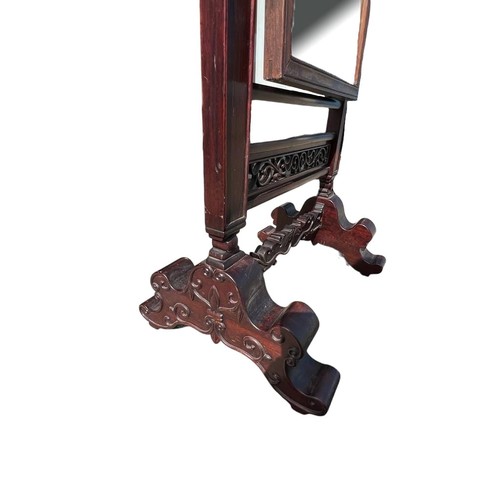 225 - A CHINESE CARVED HARDWOOD CHEVELLE MIRROR
Decorated with scrolling foliage, raised on scrolling feet... 