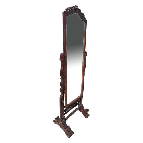 225 - A CHINESE CARVED HARDWOOD CHEVELLE MIRROR
Decorated with scrolling foliage, raised on scrolling feet... 