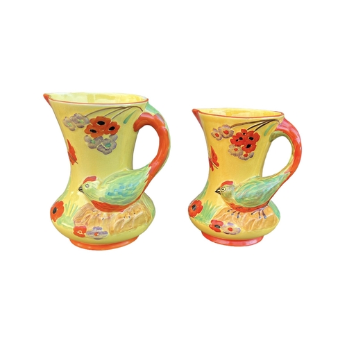 136 - WADEHEATH, ENGLAND POTTERY, TWO ART DECO BIRD JUGS, CIRCA 1930
All having yellow ground, stylised bi... 