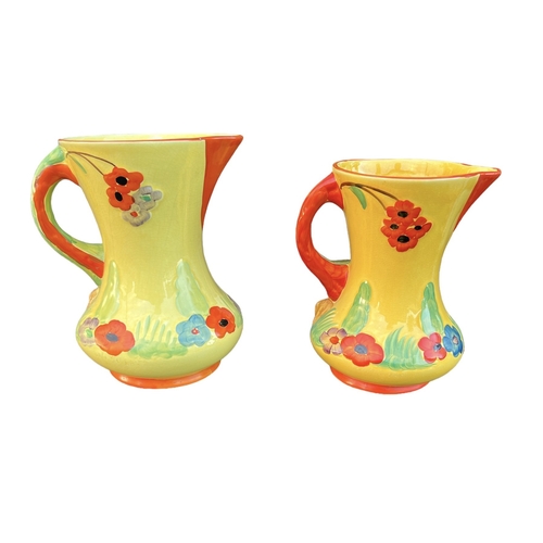 136 - WADEHEATH, ENGLAND POTTERY, TWO ART DECO BIRD JUGS, CIRCA 1930
All having yellow ground, stylised bi... 