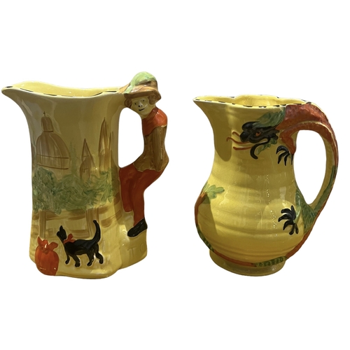 77A - ARTHUR WOOD, POTTERY, 20TH CENTURY DRAGON JUG AND DICK WHITTINGTON JUG, CIRCA 1930
Both having yello... 