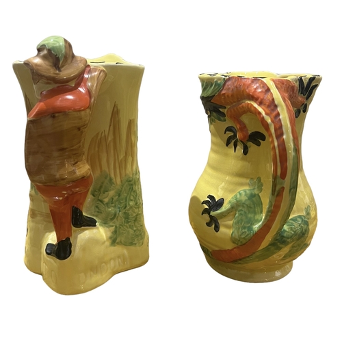 77A - ARTHUR WOOD, POTTERY, 20TH CENTURY DRAGON JUG AND DICK WHITTINGTON JUG, CIRCA 1930
Both having yello... 