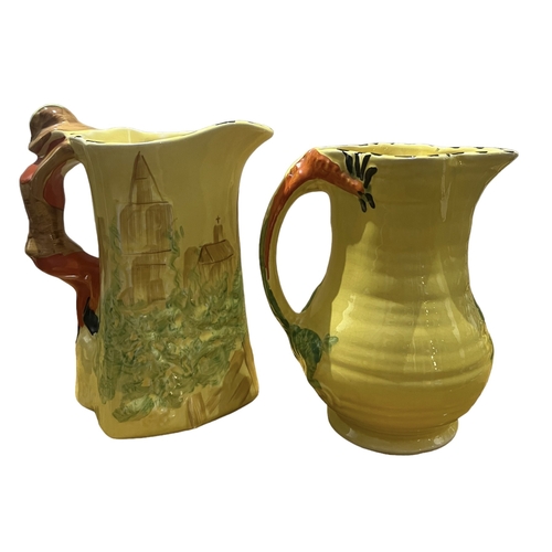 77A - ARTHUR WOOD, POTTERY, 20TH CENTURY DRAGON JUG AND DICK WHITTINGTON JUG, CIRCA 1930
Both having yello... 