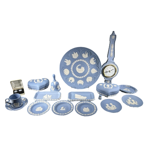 70 - WEDGWOOD, A COLLECTION OF BLUE JASPERWARE ITEMS
Comprising a plate, dishes, lidded boxes, barometer,... 