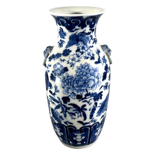 76 - A CHINESE BLUE AND WHITE VASE, BEARING KANGXI MARK TO UNDERSIDE
Decorated with birds, butterflies am... 