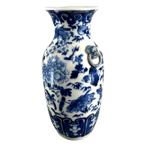 76 - A CHINESE BLUE AND WHITE VASE, BEARING KANGXI MARK TO UNDERSIDE
Decorated with birds, butterflies am... 