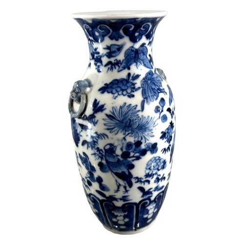 76 - A CHINESE BLUE AND WHITE VASE, BEARING KANGXI MARK TO UNDERSIDE
Decorated with birds, butterflies am... 