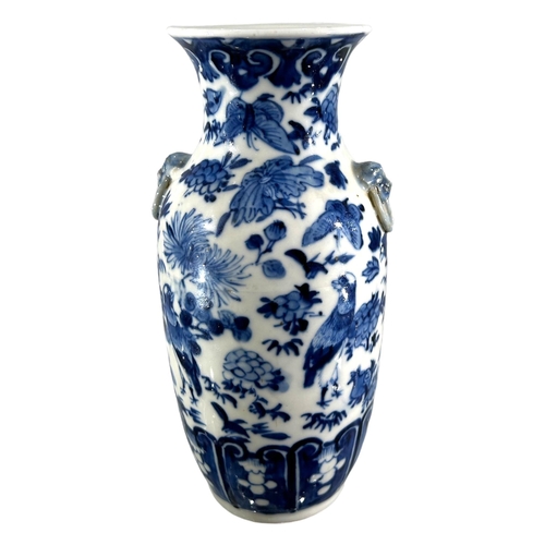 76 - A CHINESE BLUE AND WHITE VASE, BEARING KANGXI MARK TO UNDERSIDE
Decorated with birds, butterflies am... 