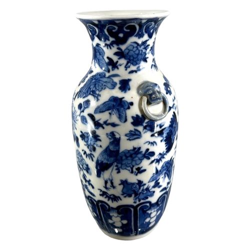 76 - A CHINESE BLUE AND WHITE VASE, BEARING KANGXI MARK TO UNDERSIDE
Decorated with birds, butterflies am... 