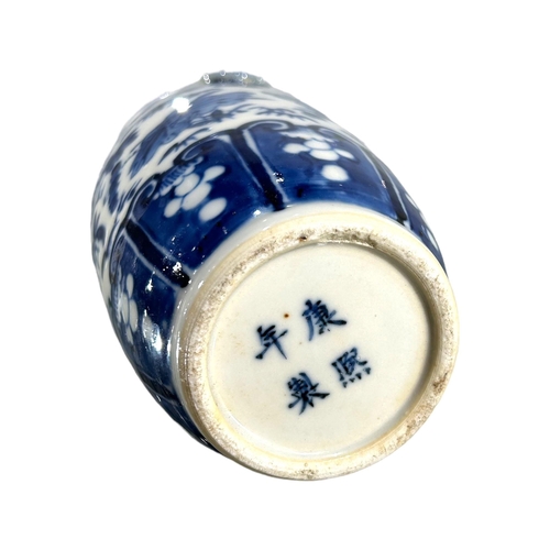 76 - A CHINESE BLUE AND WHITE VASE, BEARING KANGXI MARK TO UNDERSIDE
Decorated with birds, butterflies am... 